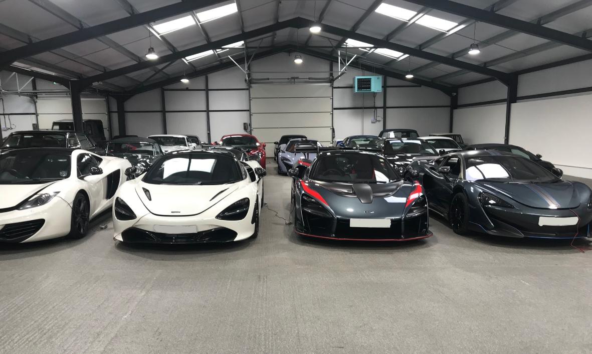 Displaying the inside of one of our past client's premises with many high-value supercars, approximately £16-20 million's worth.
